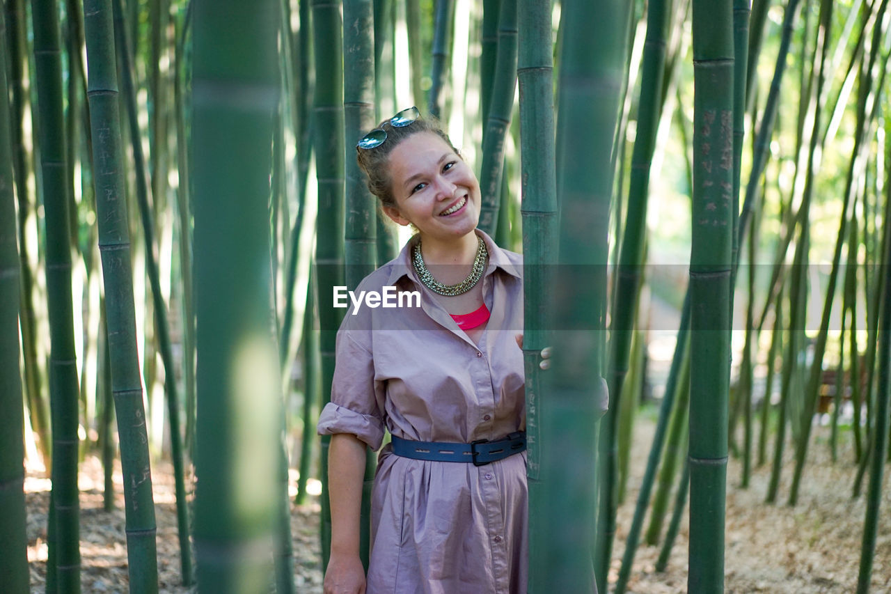 A young woman in a bamboo grove