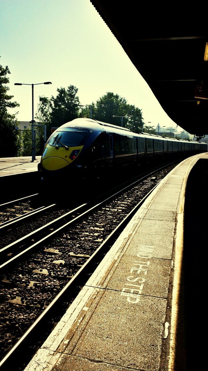 TRAIN ON RAILROAD TRACKS