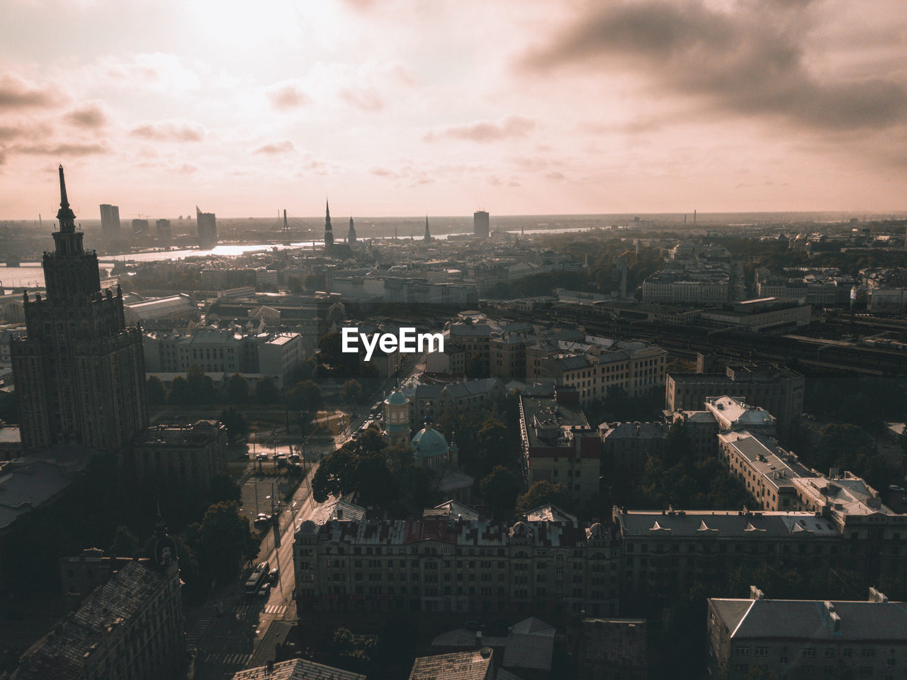 High angle view of buildings in city against sky during sunset