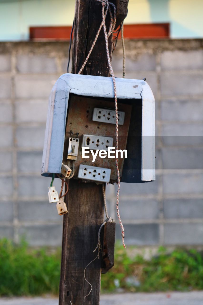 CLOSE-UP OF BIRDHOUSE IN HOUSE