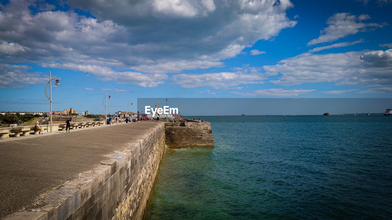 PANORAMIC VIEW OF BEACH AGAINST SKY