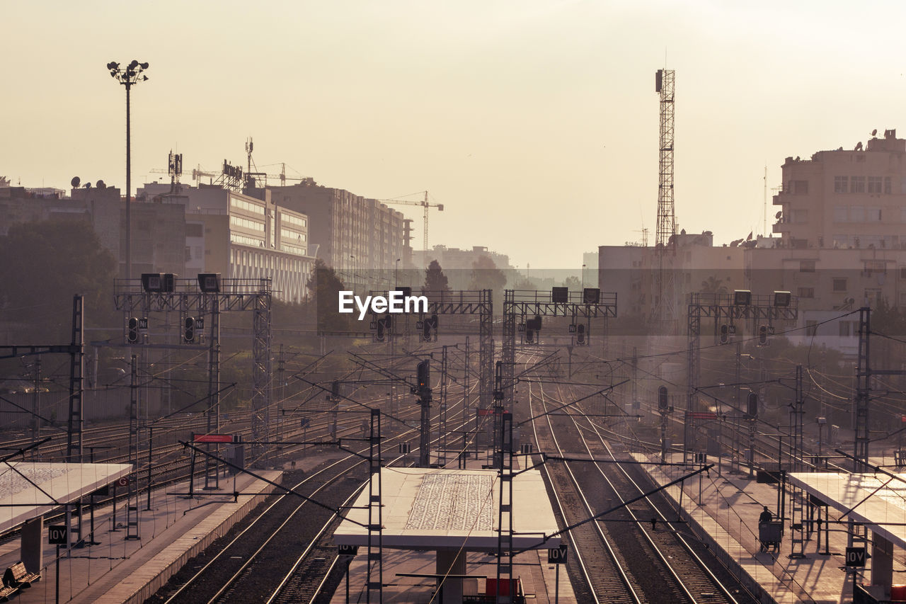 Power lines on railroad tracks in city