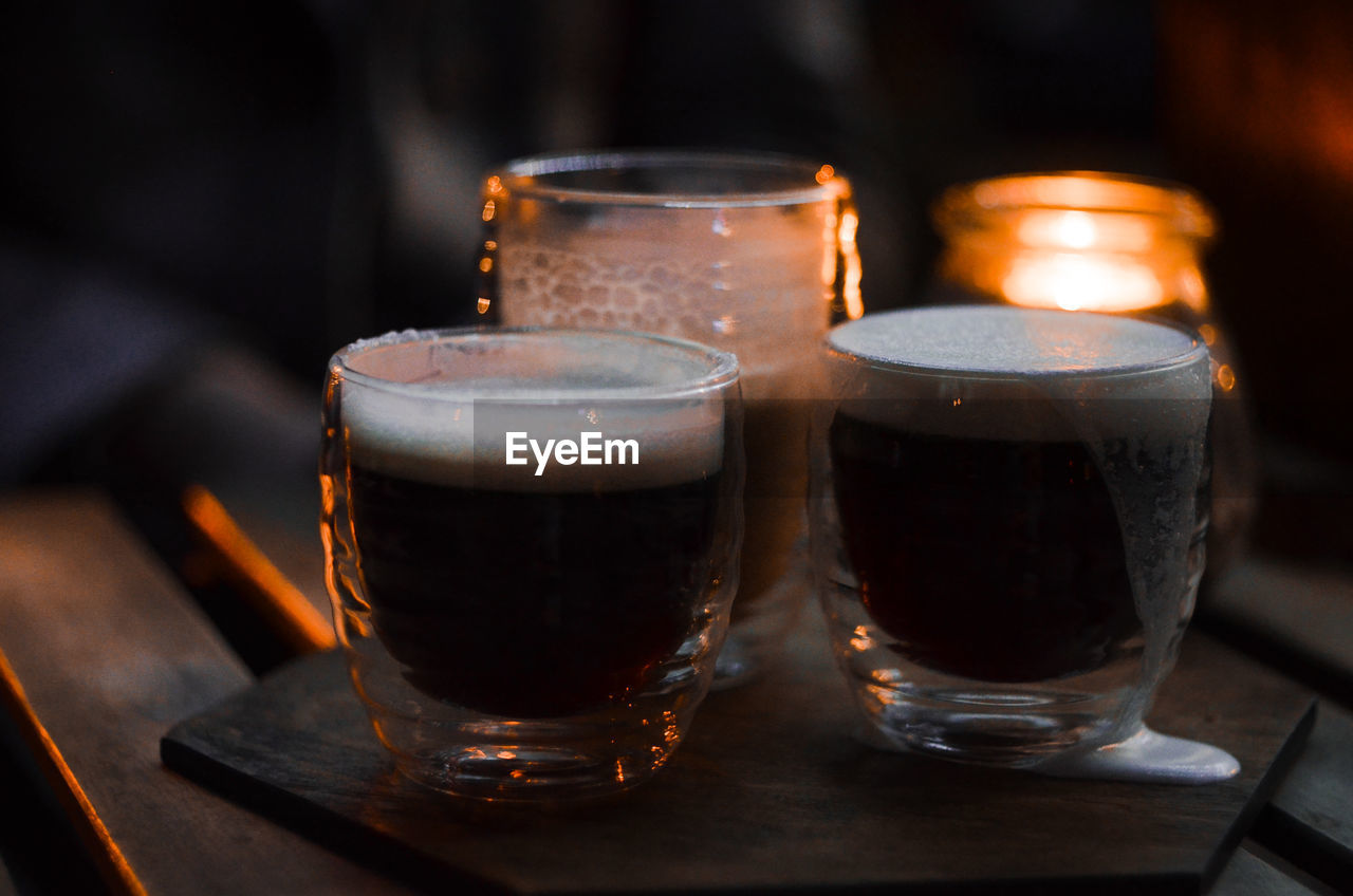 Close-up of cups with coffee on table