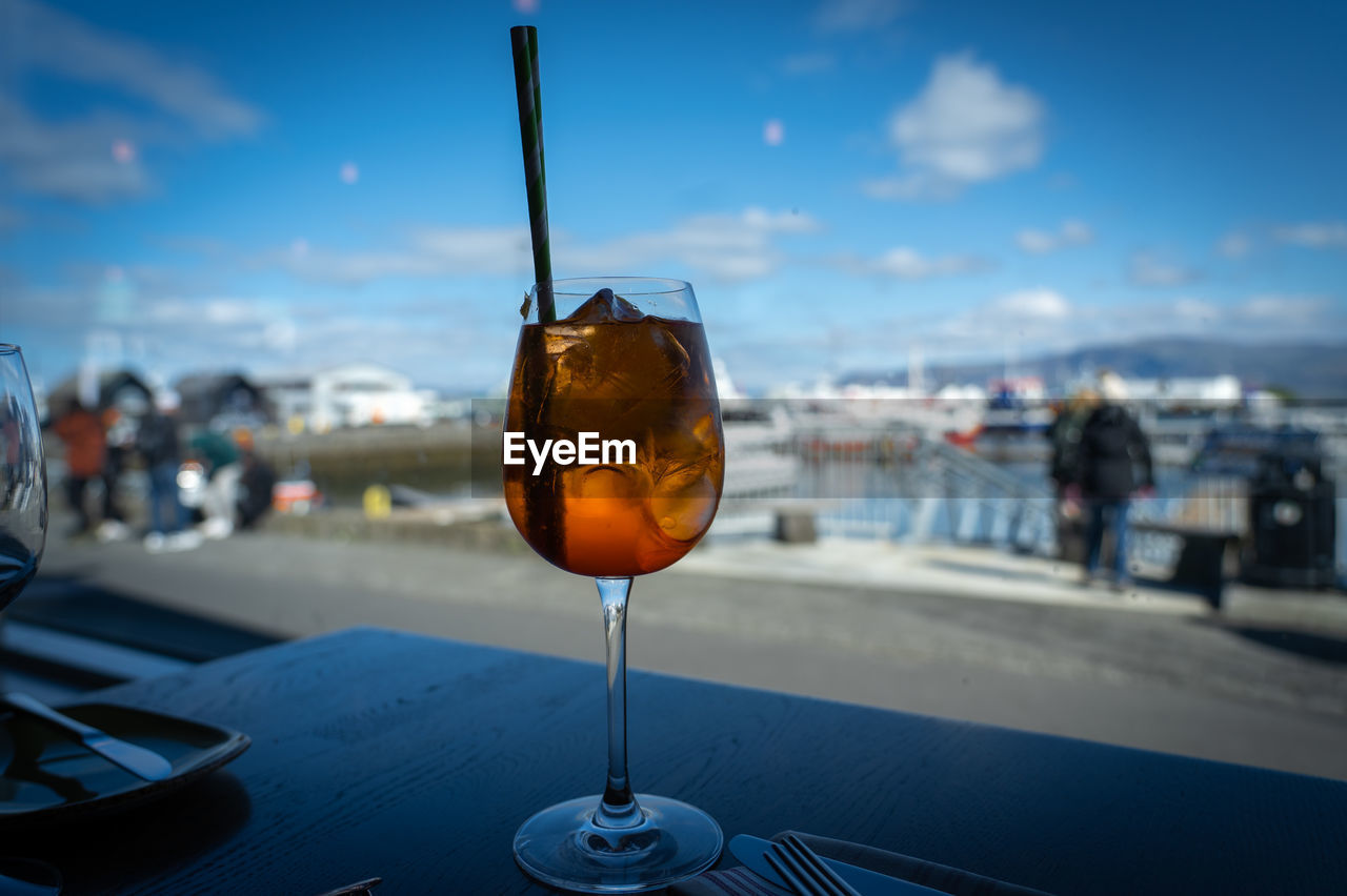 Close-up of aperol drink on table