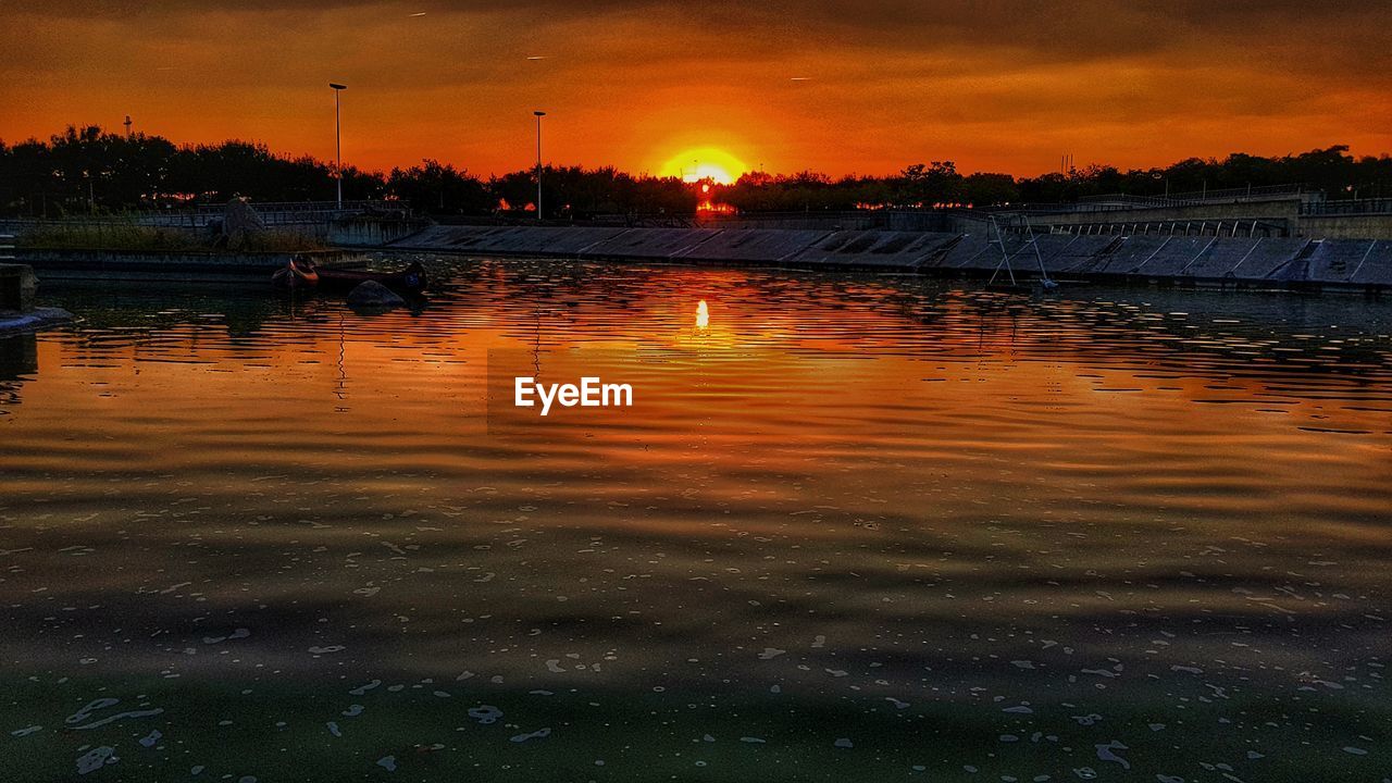 SCENIC VIEW OF LAKE DURING SUNSET