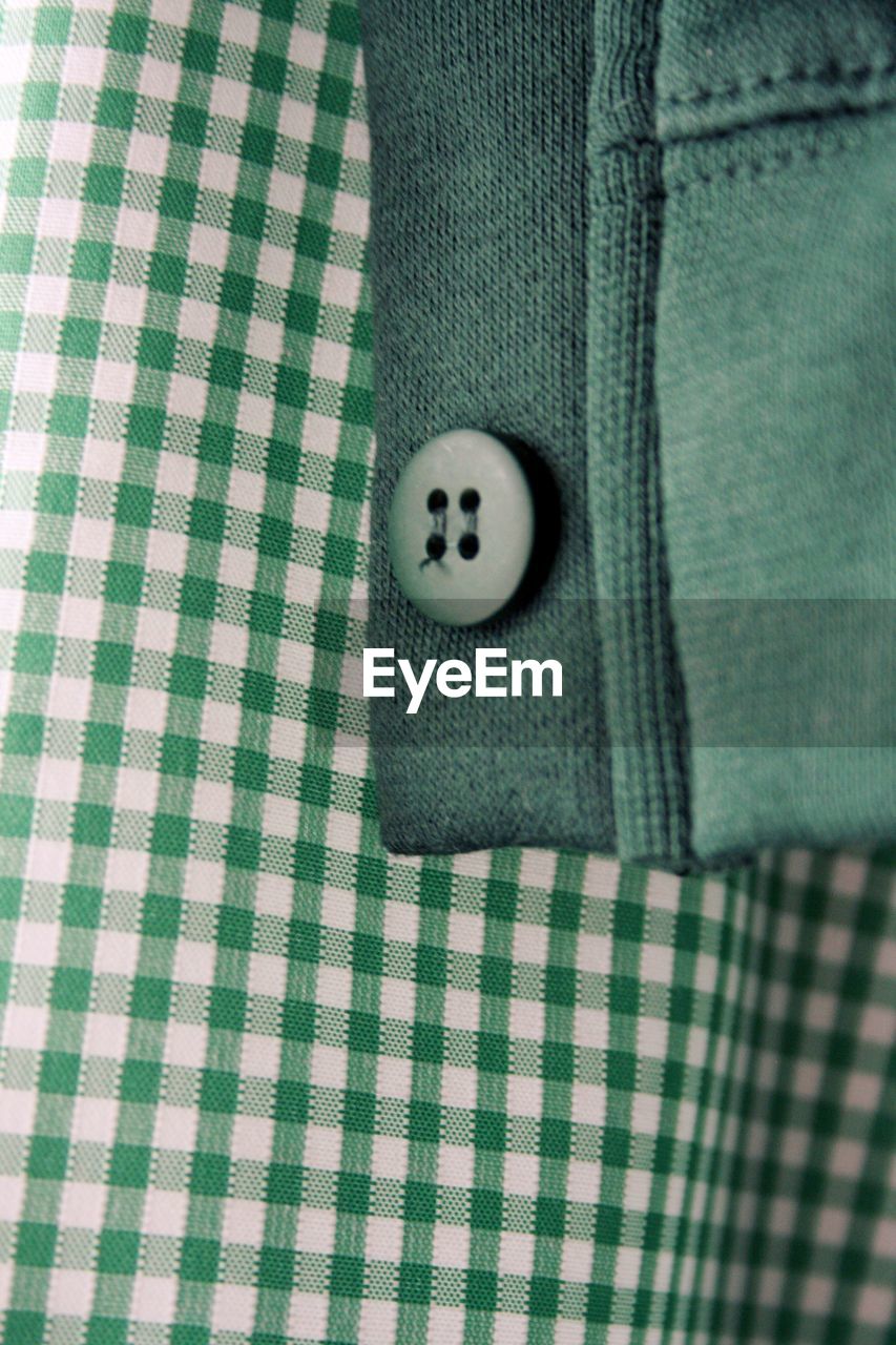 Close-up of button on fabric