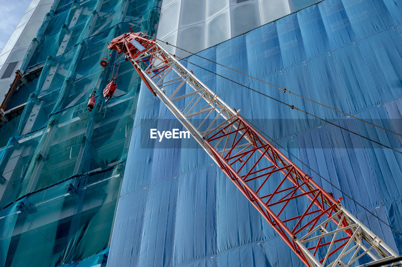 Low angle view of construction site against sky