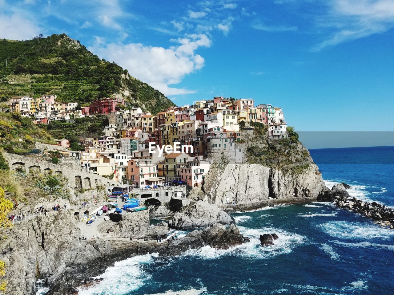 Panoramic view of sea and buildings against sky