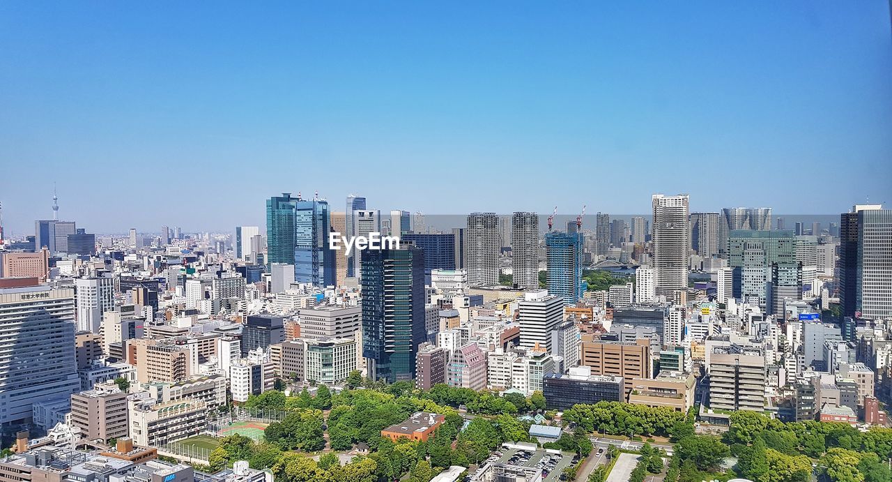 High angle view of buildings against clear sky