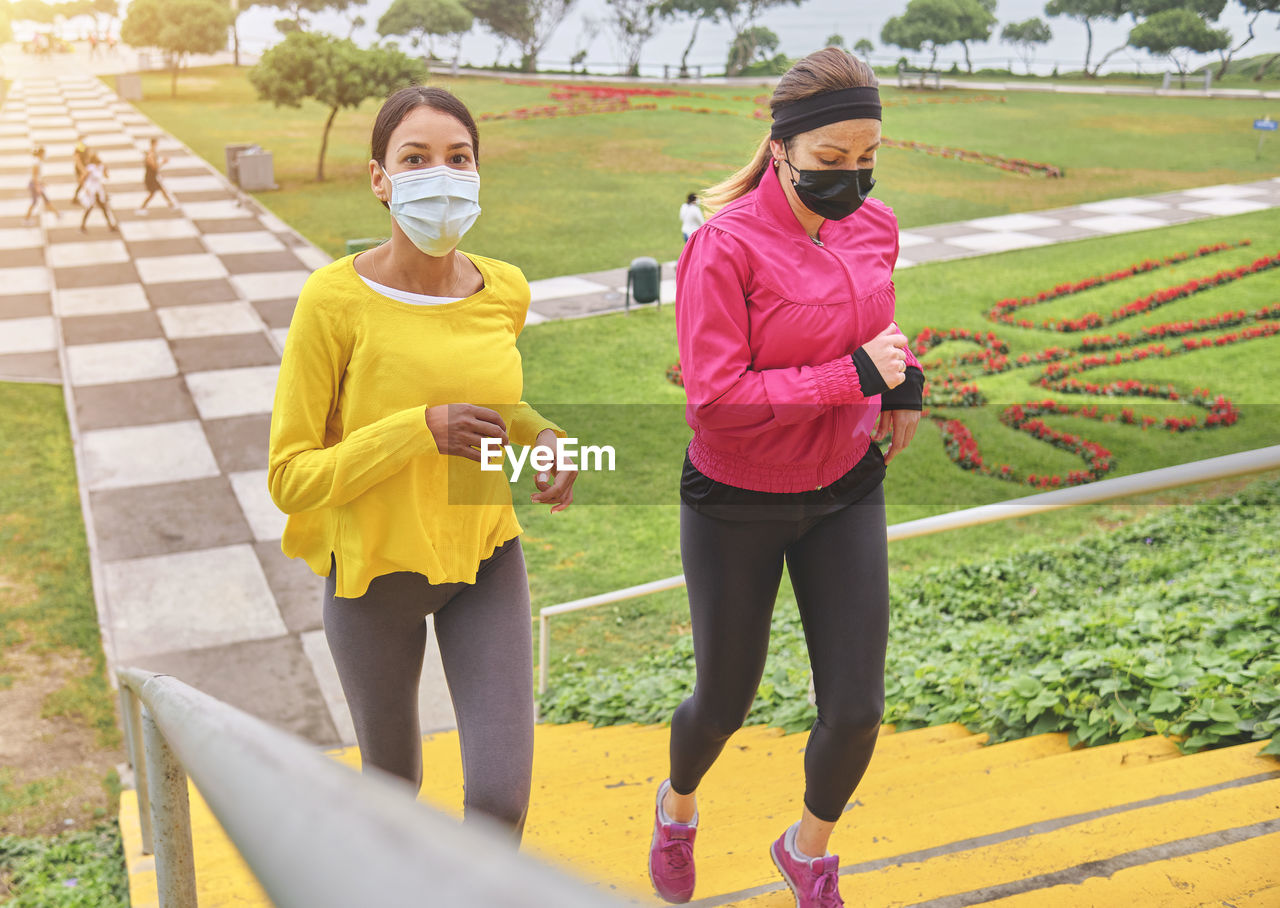 Multiethnic women jogging on the street.