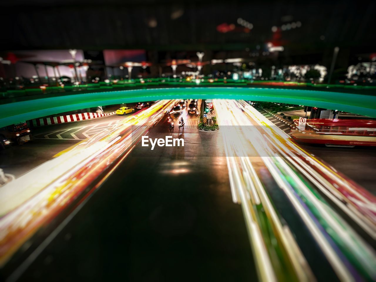 HIGH ANGLE VIEW OF LIGHT TRAILS ON ROAD