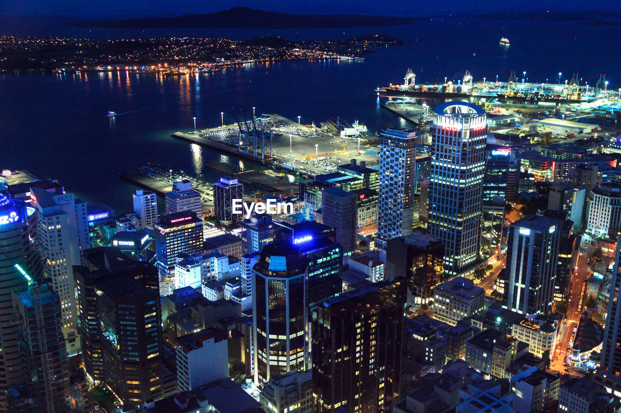 High angle view of city lit up at night