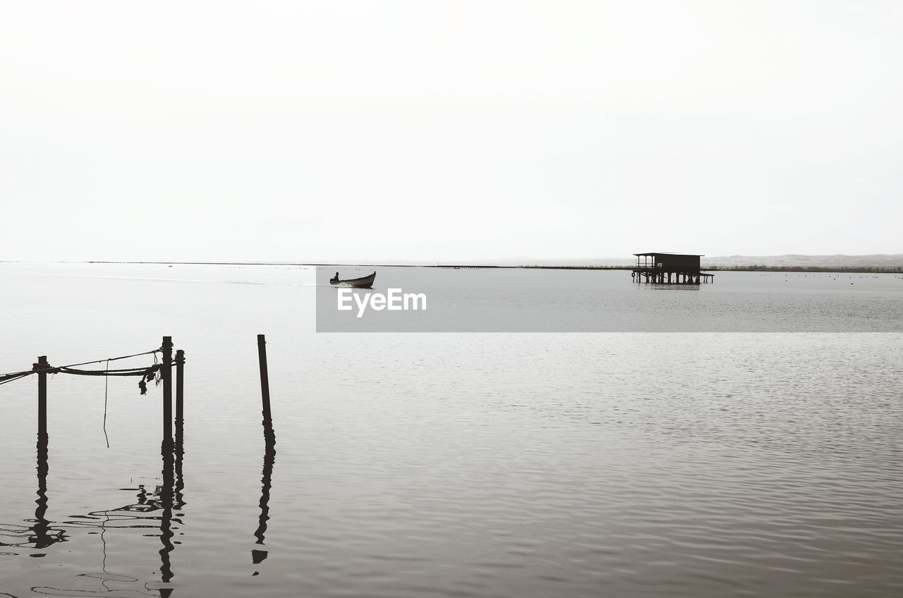 WOODEN POSTS IN SEA