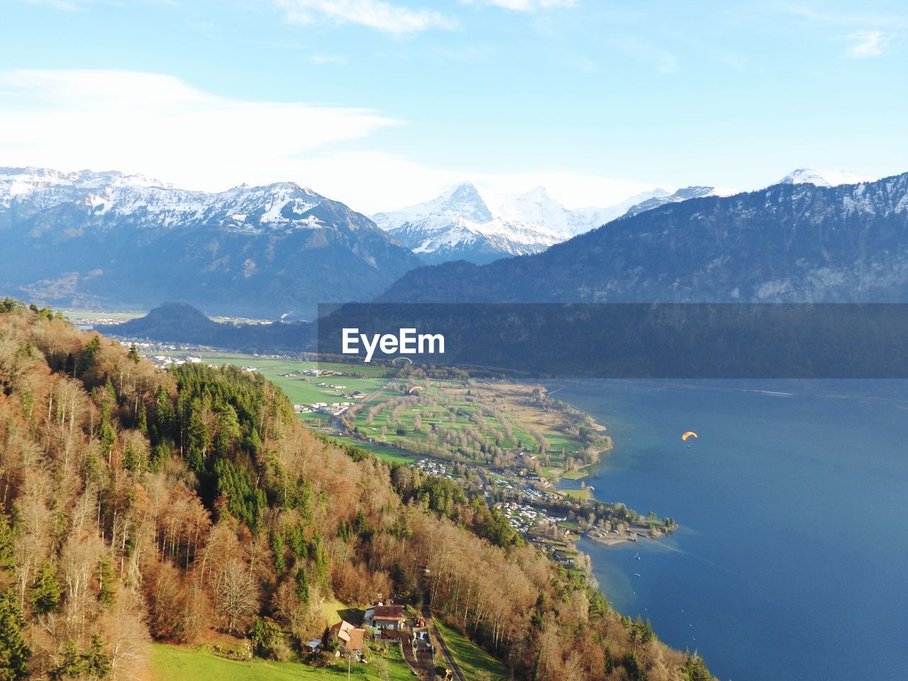 Scenic view of lake and mountains against sky