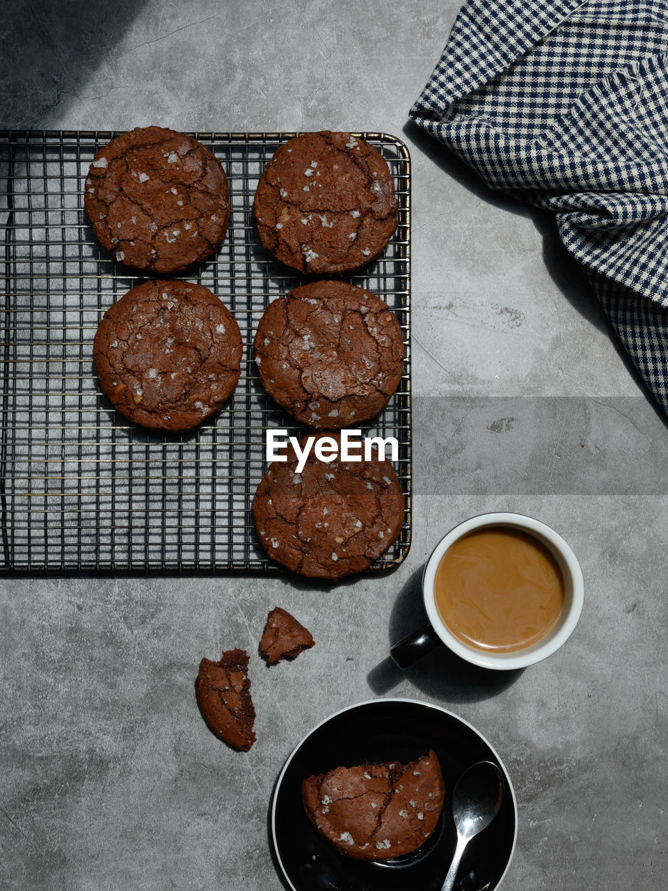 High angle view of coffee and cookie on table