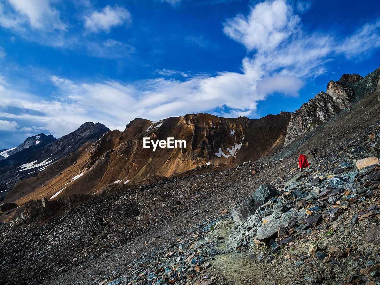 Scenic view of mountains against sky and clouds