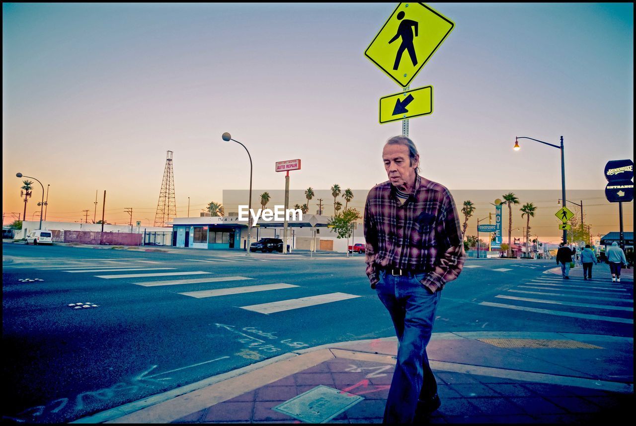 FULL LENGTH OF A MAN SKATEBOARDING