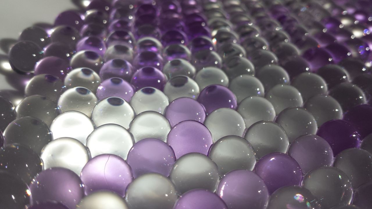 Close-up of gray and purple balls