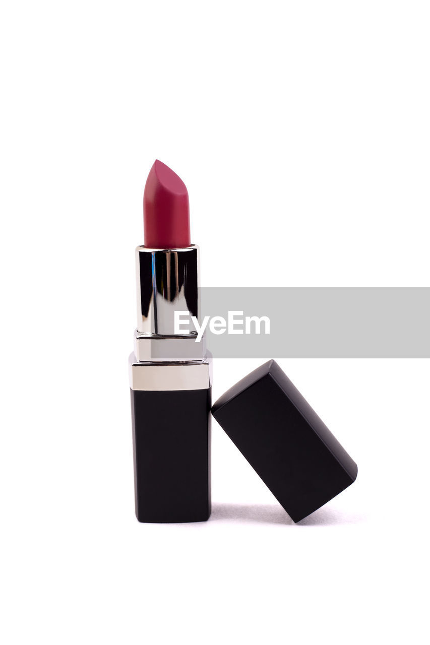 Close-up of lipstick over white background
