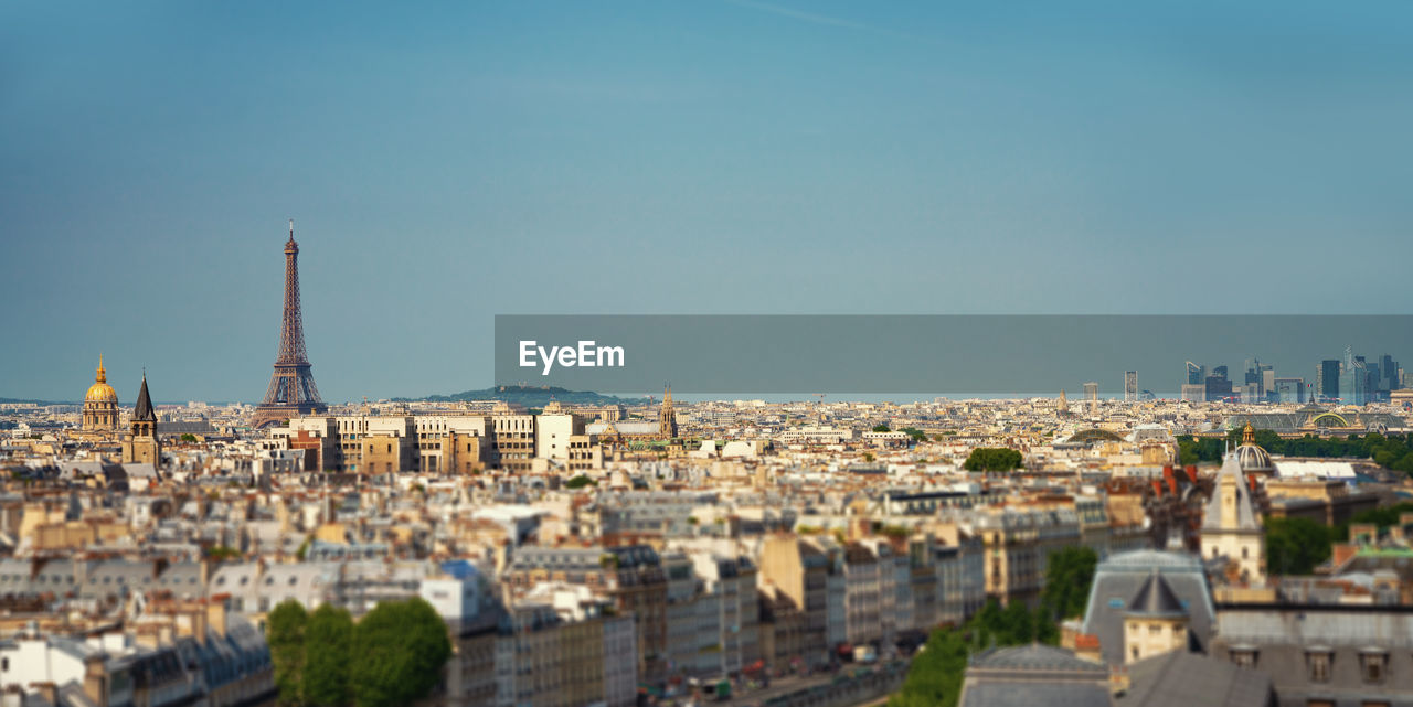 BUILDINGS IN CITY AGAINST SKY