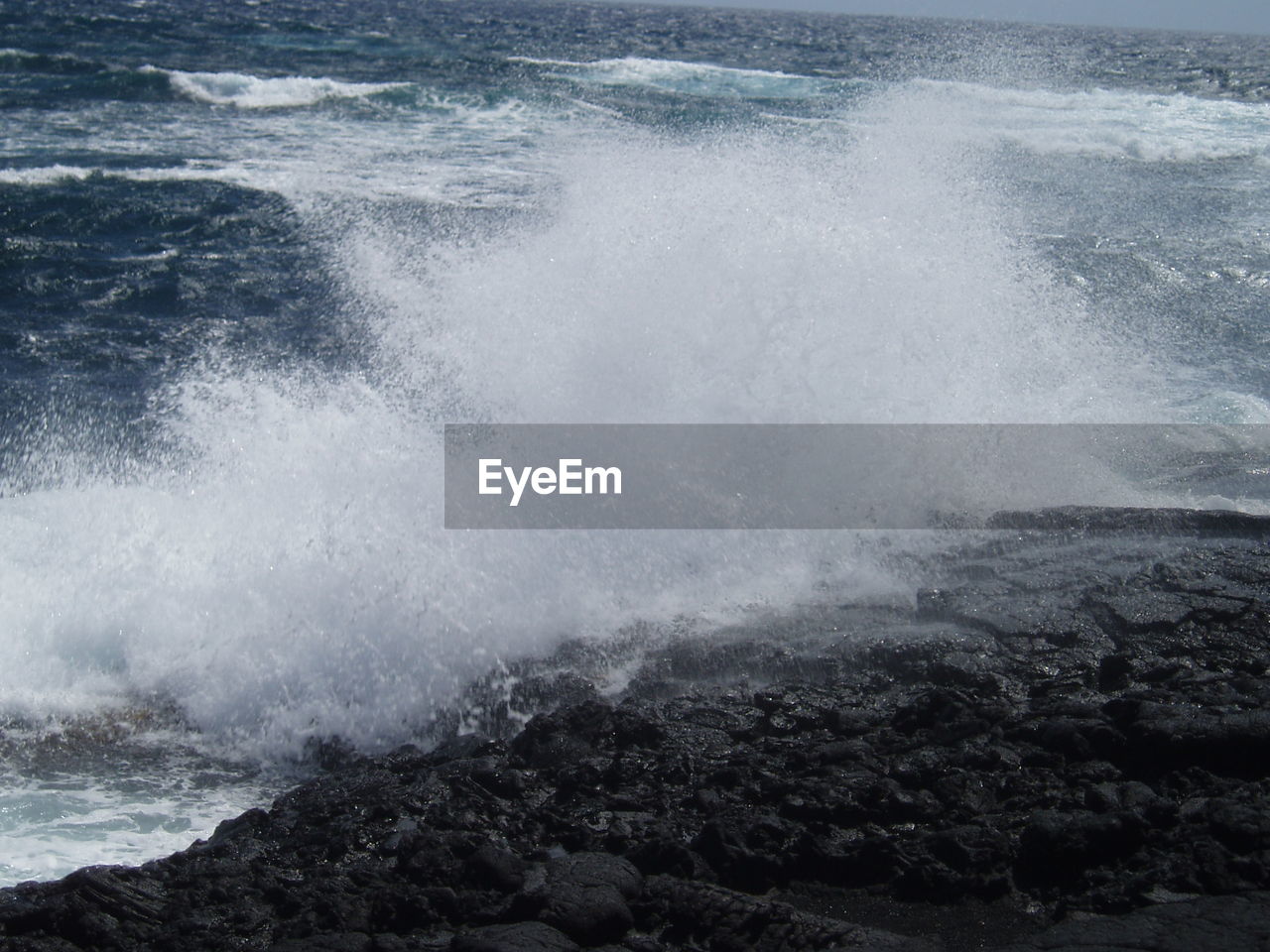 WAVES SPLASHING ON SEA SHORE