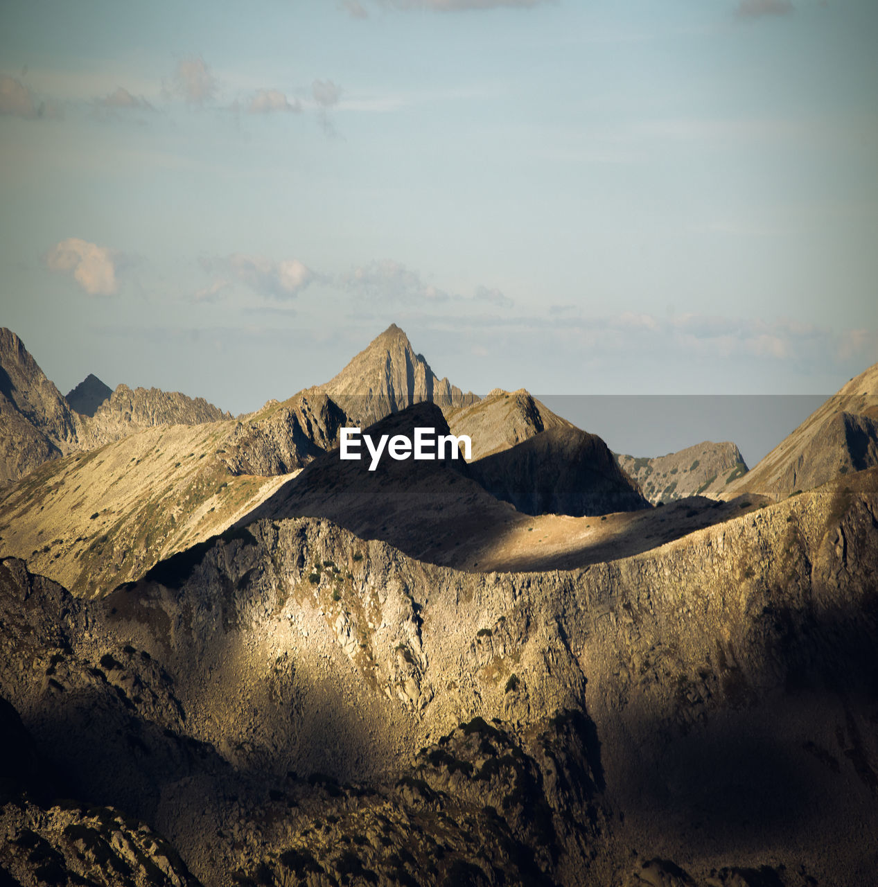 Scenic view of rocky mountains against sky