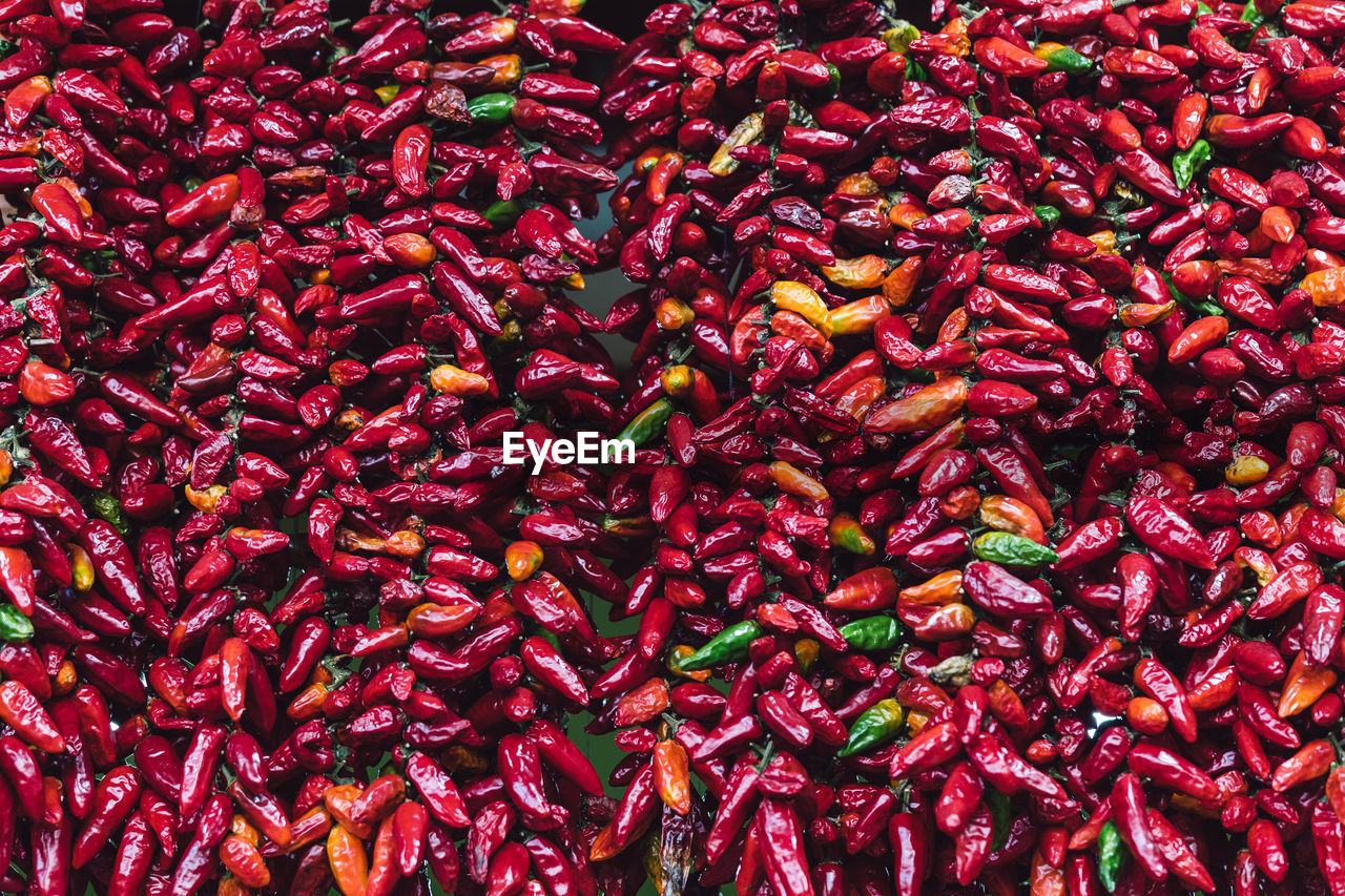 Full frame shot of red chili peppers at market