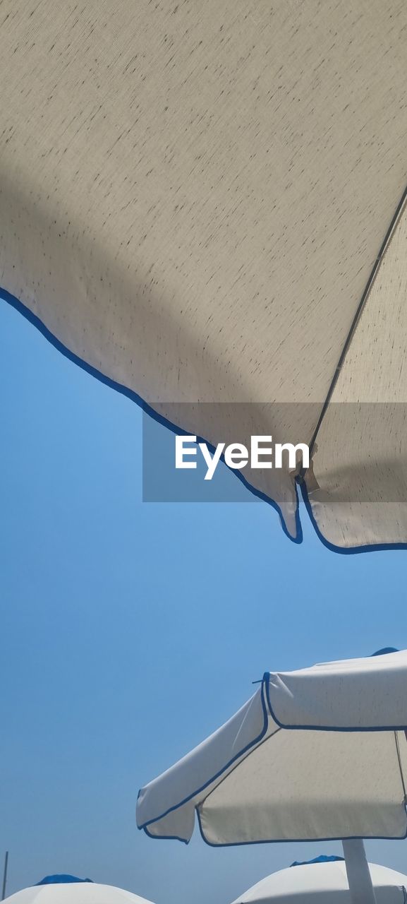 blue, no people, day, low angle view, nature, clear sky, sky, architecture, outdoors, wall - building feature, close-up, built structure