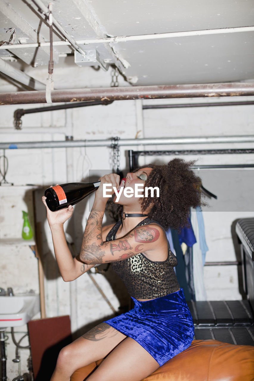 Young woman dancing backstage