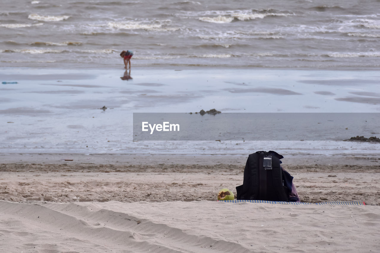 shore, land, beach, water, sea, ocean, wave, coast, sand, body of water, nature, wind wave, one person, day, beauty in nature, men, outdoors, full length, motion, rear view, scenics - nature, leisure activity, lifestyles, adult