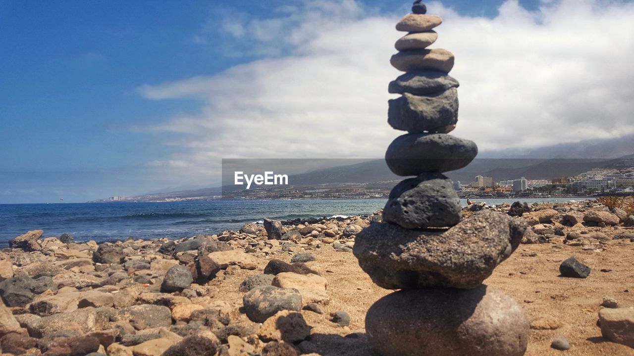 STACK OF STONES AT BEACH