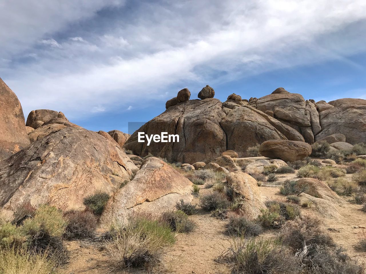 Rock formations on landscape against sky