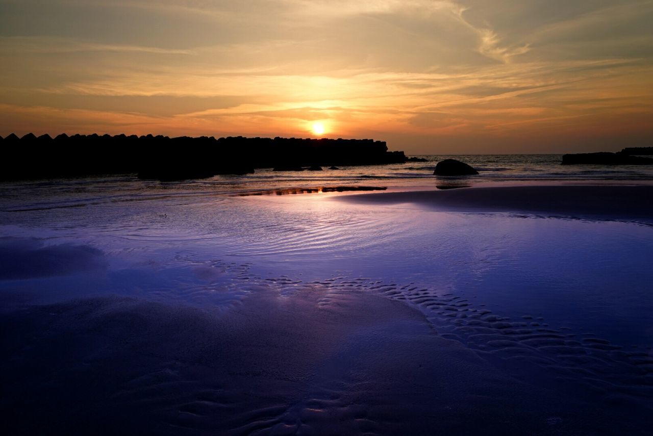 Scenic view of sea against dramatic sky