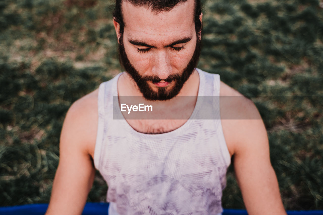 Man doing yoga on mountain