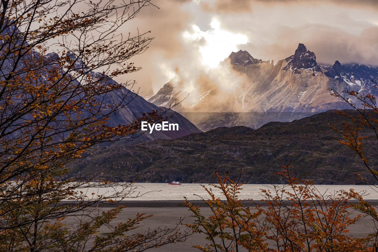 nature, mountain, morning, environment, scenics - nature, sky, beauty in nature, tree, landscape, cloud, wilderness, winter, snow, plant, water, mountain range, cold temperature, reflection, autumn, land, travel destinations, travel, no people, lake, mountain peak, tourism, tranquility, outdoors, sunlight, fog, forest, snowcapped mountain, tranquil scene, non-urban scene, sun, pinaceae