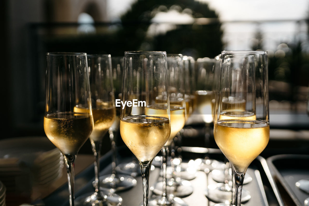 CLOSE-UP OF WINE IN GLASSES ON TABLE