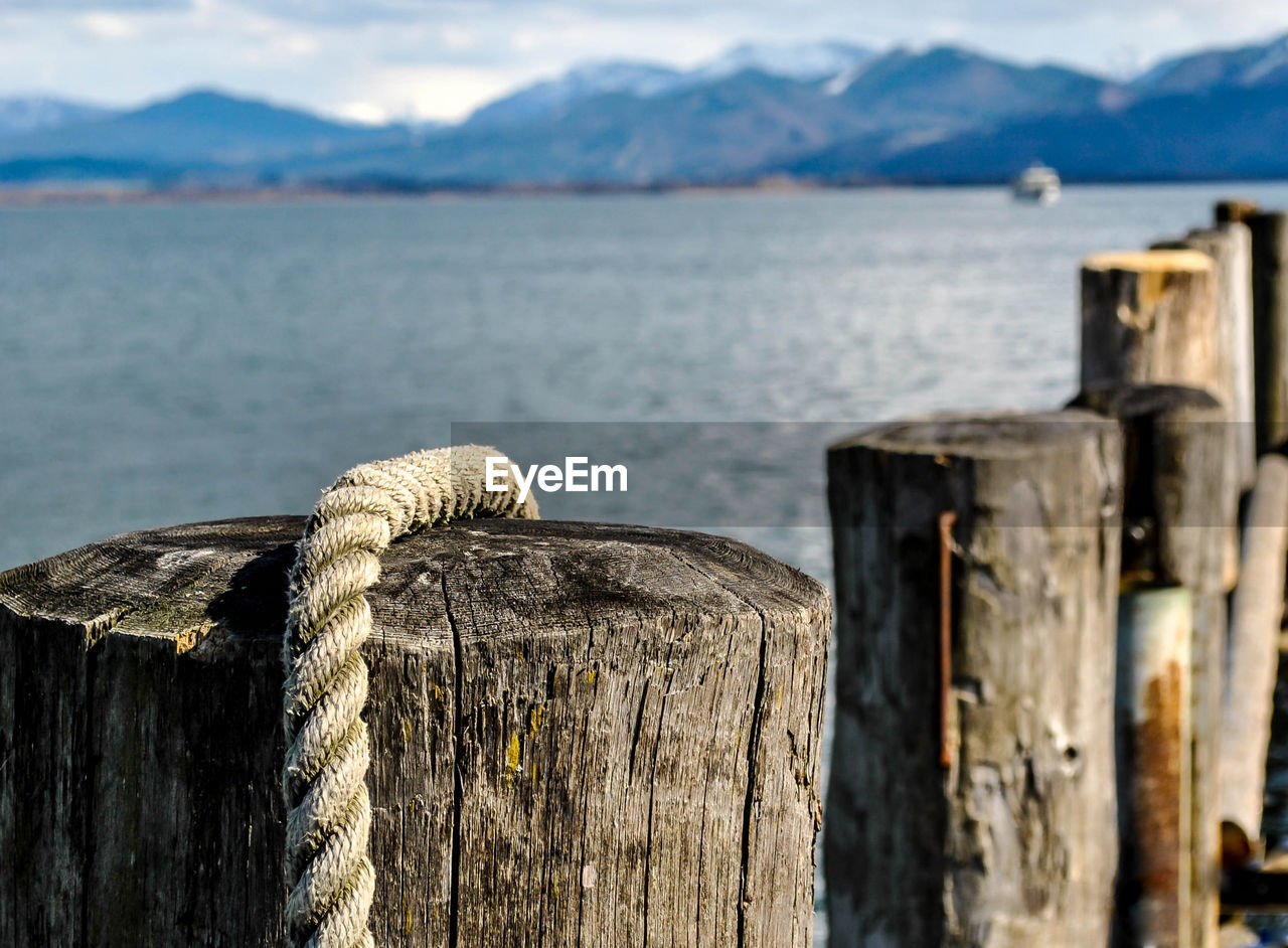 Close-up of wooden post in lake