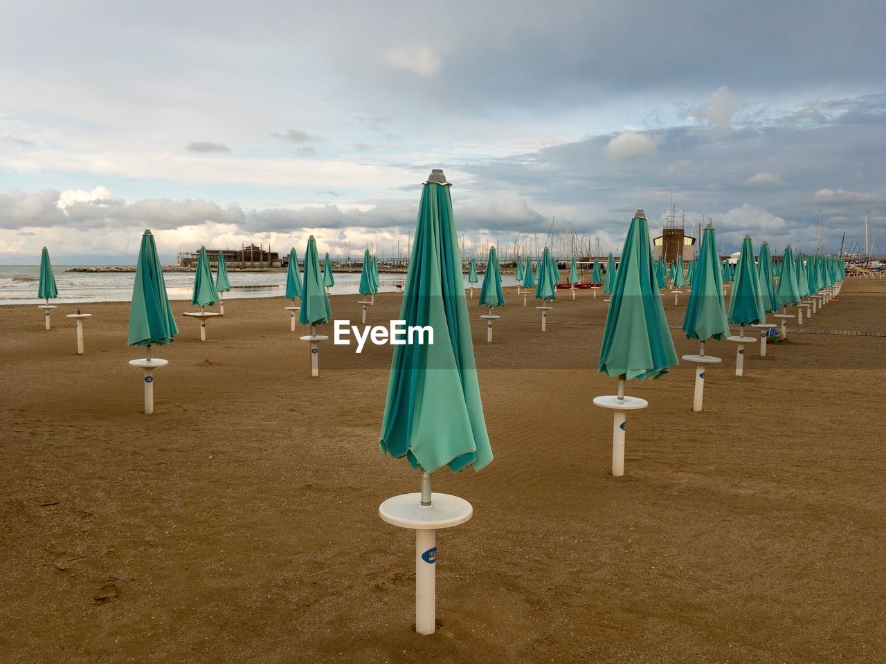 Closing of the season in the adriatic.  sun umbrellas on the beach