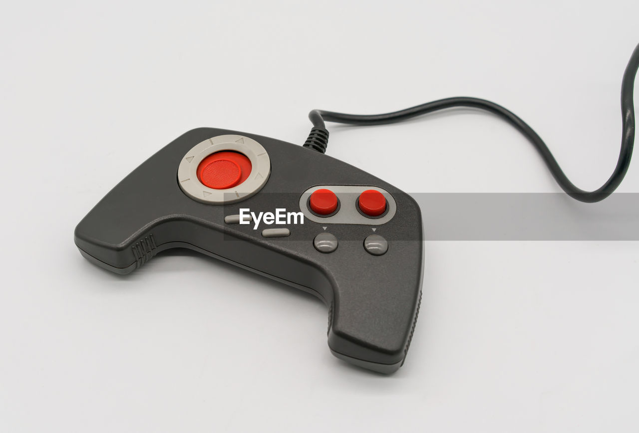 Close-up of gamepad over white background