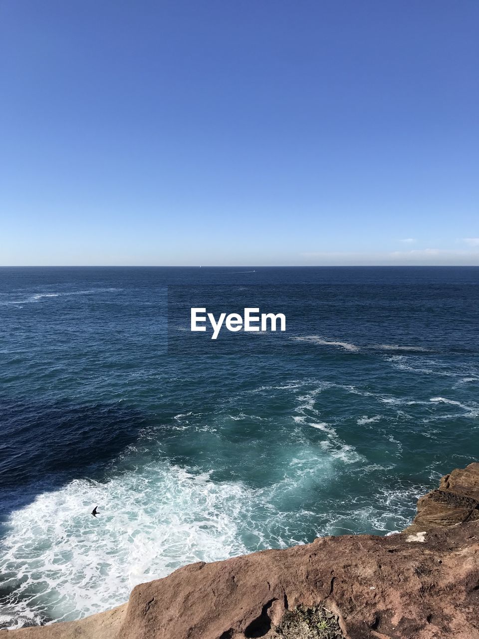 SCENIC VIEW OF SEA AGAINST BLUE SKY