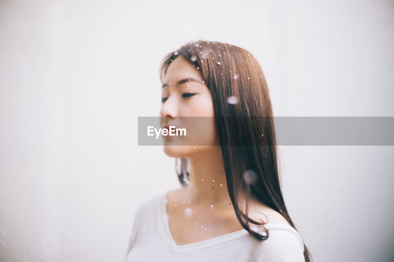 Young woman with water drops