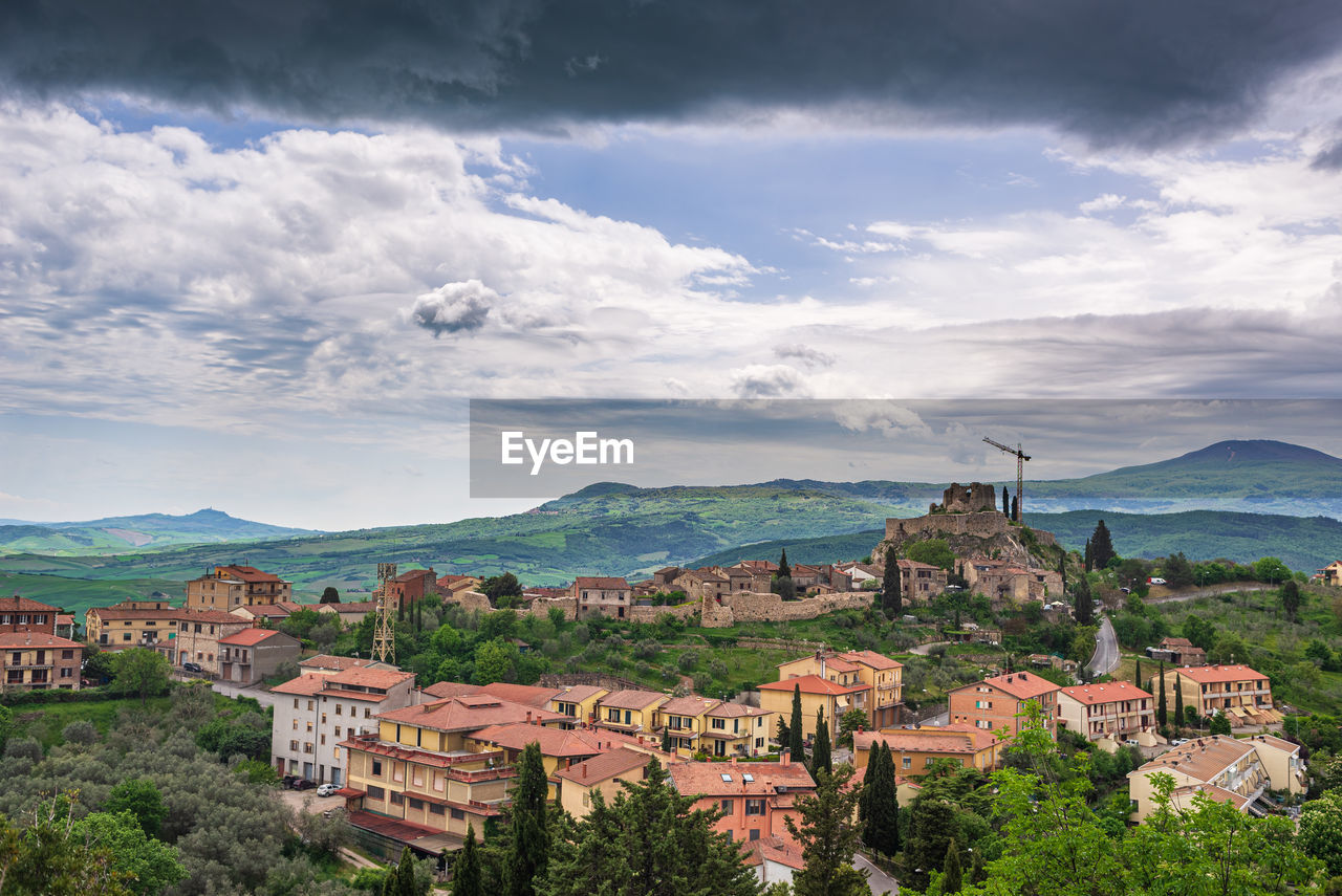 high angle view of townscape against cloudy sky