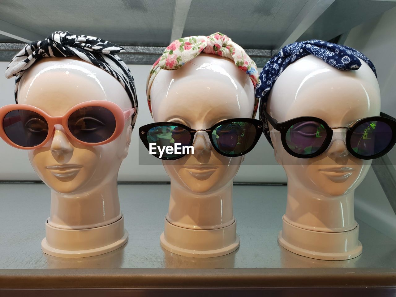 Close-up of headscarf and sunglasses on mannequins