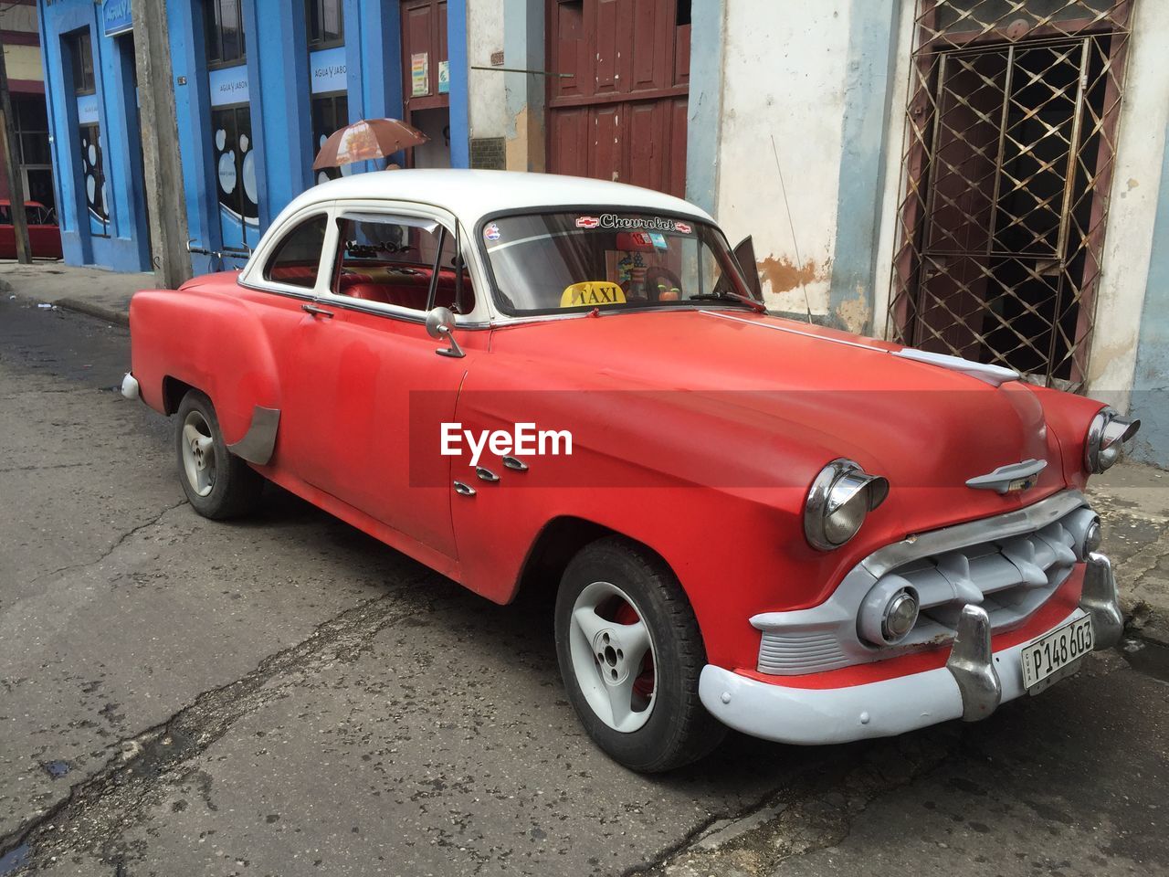 VINTAGE CAR PARKED ON ROAD