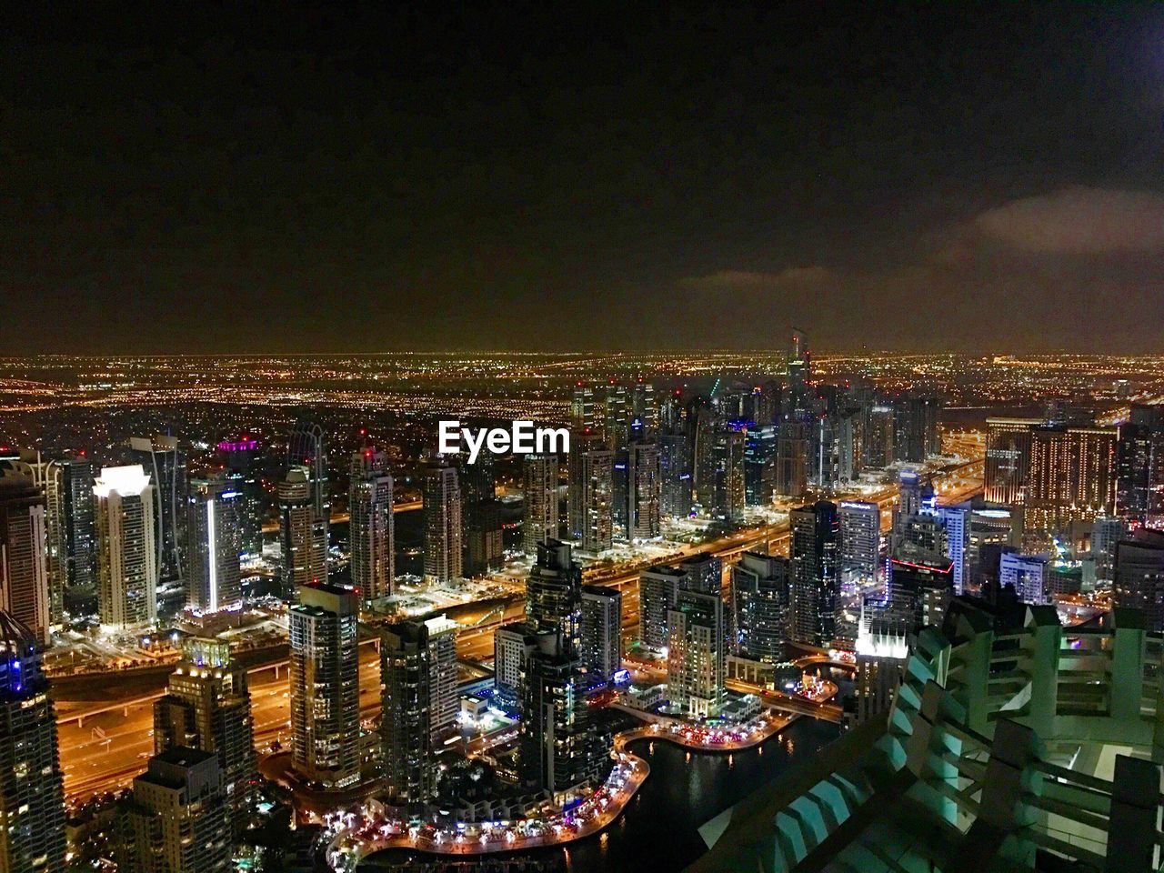 High angle view of illuminated buildings in city at night