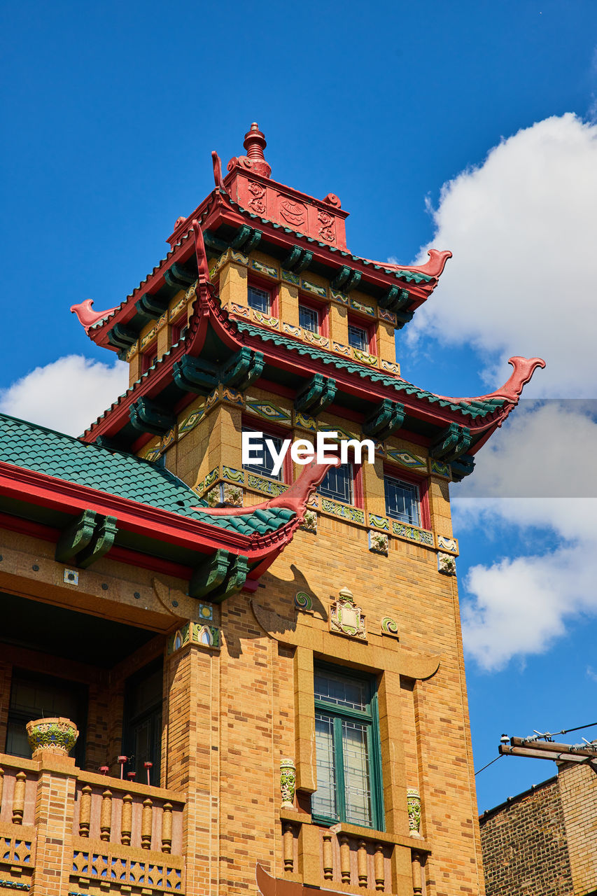 low angle view of building against blue sky