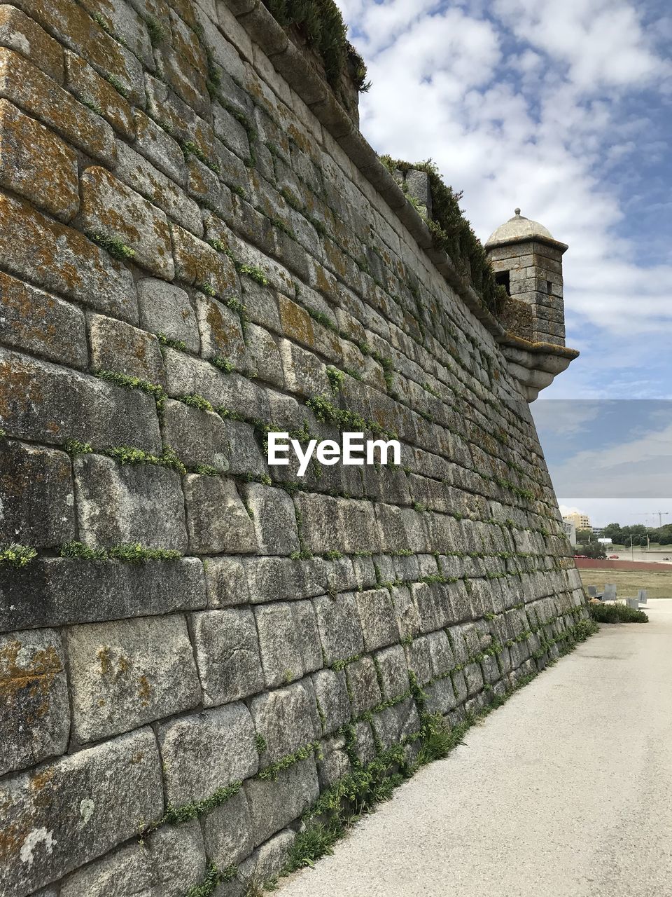 STONE WALL OF FORT AGAINST SKY