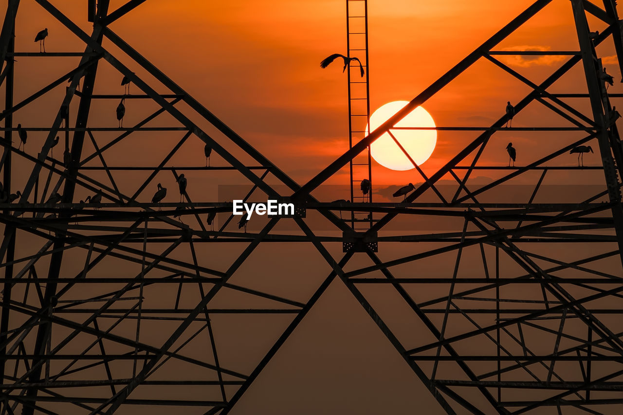 sky, technology, built structure, architecture, electricity pylon, power generation, silhouette, sunset, electricity, power supply, line, industry, no people, metal, alloy, steel, nature, orange color, transmission tower, cable, communication, pattern, cloud, abstract, tower, grid, global communications, construction frame, outdoors, electrical grid, high voltage sign, backgrounds, girder, circle