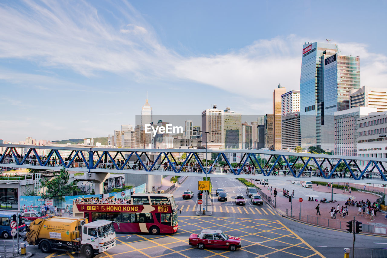 View of bridge and buildings against sky in city