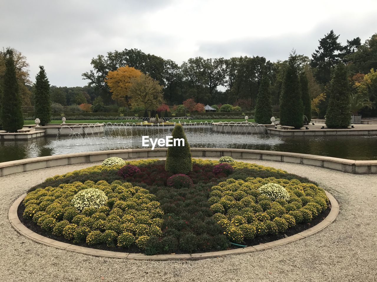 FOUNTAIN AND TREES AGAINST SKY